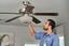 Mr. Electric service electrician repairing a ceiling fan